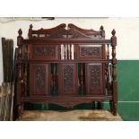 A late 19th / early 20th century carved mahogany bed with panelled decoration