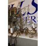 A continental style brass chandelier with faceted drops