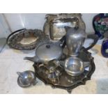 An English pewter 4 piece tea service; a silver plated tray with scalloped edges; other silver