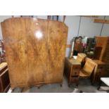 A 1930's 4 piece bedroom suite in figured walnut by Page Bros, comprising triple wardrobe, gents