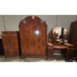 An Art Deco period bedroom suite in crossbanded and figured walnut, comprising double door wardrobe,