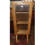 An Ercol light elm display cabinet on later legs
