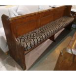 A gothic carved pitch pine bench, 240 cm