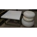 Three graduating stools/occasional tables in mushroom shaped white plastic; a similar coffee table