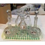 A 19th century pair of slice cut mallet shaped decanters; an Edwardian pair of cut sherry