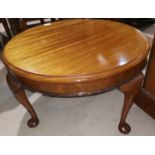 A 1930's mahogany coffee table with circular top; a Georgian style wine table; a nest of 2