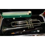 A Lyle De Luxe trumpet, cased; 2 other instruments