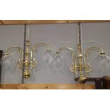 A pair of brass pendant lights, 2 branch with pear shaped shades