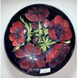 A Moorcroft circular fruit bowl, anemone pattern, impressed and signed, diameter 26 cm