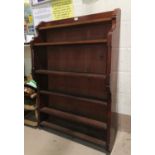 An early 20th century mahogany wall hanging bookcase in the gothic manner