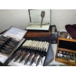 A fitted box with scientific weights; etc.; a selection of EPNS cutlery, boxed