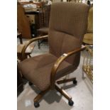 A mid 20th century office swivel chair in brown tweed