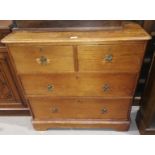 A Victorian stripped pine chest of 2 long and 2 short drawers