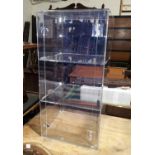 A perspex three height display cabinet no key