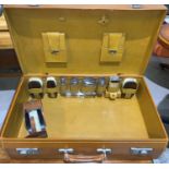 A mid 20th century gents overnight case in brown leather, English made, fitted hallmarked silver