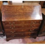 An 18th century oak fall front bureau with fitted interior and 4 drawers, on bracket feet