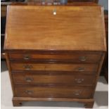 A Georgian style crossbanded mahogany bureau with fall front, fitted interior and 4 drawers, on