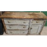 A Victorian painted pine dresser base with 4 drawers and single cupboard