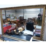 A gilt framed wall mirror with bevelled plate. 48' wide