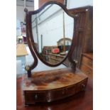 A Regency mahogany dressing table glass, the shield plate on bowfronted base with three drawers,