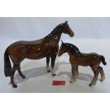 A Beswick mare and foal