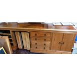 A pine desk of recent manufacture, the leather inlet top over a kneehole, two flights of four