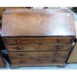 A George III elm bureau, the sloping fall over four long drawers. 40' wide