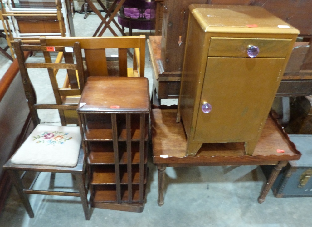 A mahogany revolving bookcase, a mahogany tray top low table, a bedroom chair and a bedside cabinet
