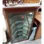 A mahogany and line inlaid hanging corner cupboard enclosed by an astragal glazed door. 39' high