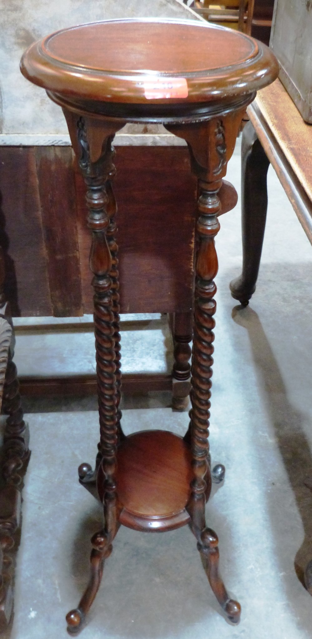 A mahogany barleytwist torchere of recent manufacture