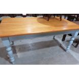 A pine kitchen table on painted support with turned legs. 66' long