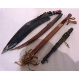 A Gurkha kukri knife and three ethnic daggers