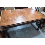 A Victorian oak dining table on cabriole legs. 60' long