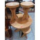 A small elm table with four stools