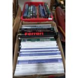 Two boxes of motoring books and auction catalogues