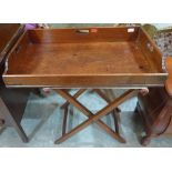 A 19th century mahogany butler's serving tray on folding stand. 32' wide