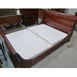 A 4'6' mahogany sleigh bedstead by AND SO TO BED, LONDON