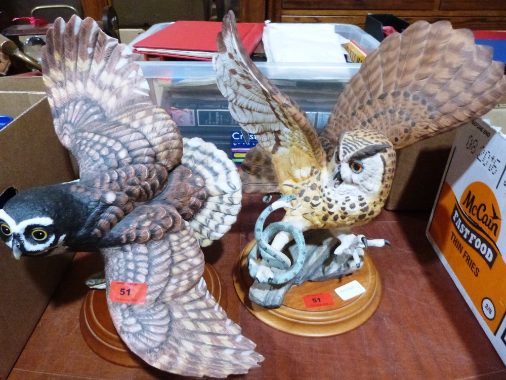Two bisque porcelain owl figures by The Franklin Mint. One with chipped wing