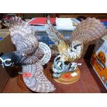 Two bisque porcelain owl figures by The Franklin Mint. One with chipped wing
