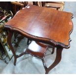 An Edwardian mahogany centre table, a brass triptych mirror firescreen and an oval wall mirror