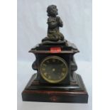 A French slate and marble mantle clock with drum movement striking on a bell, the case with bronze