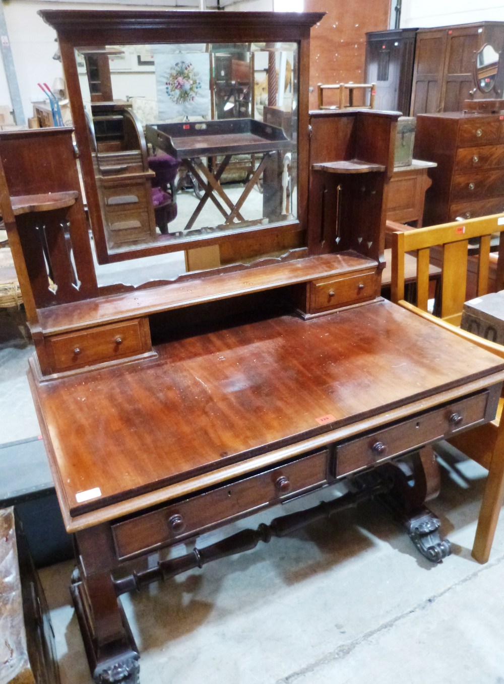 A William IV mahogany sofa table on lyre end standard support with volute feet. The top with later