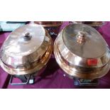 A pair of ovid copper and stainless steel lined chaffing dishes with copper and tinned covers and
