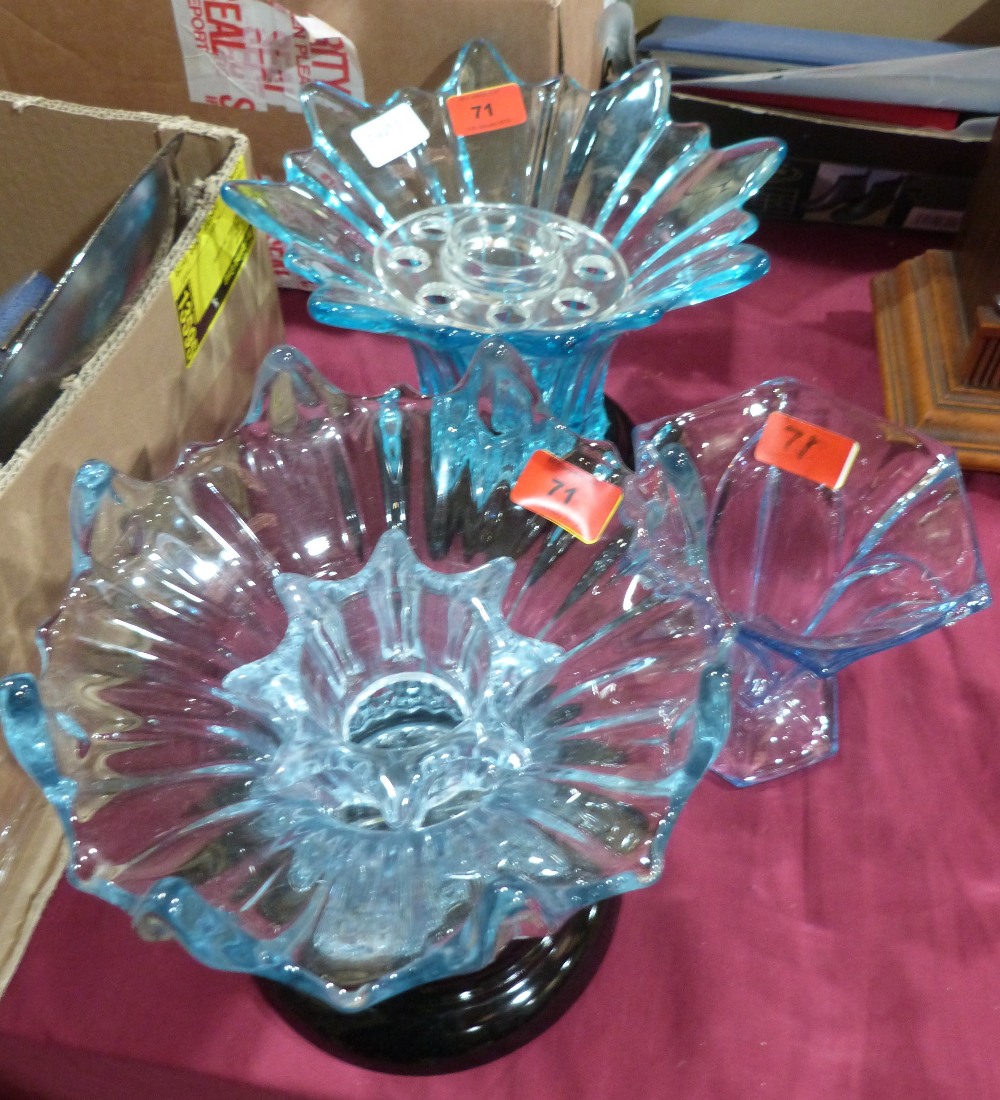 Three blue glass vases