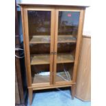 A pine veneered display cabinet on stand. 35' wide