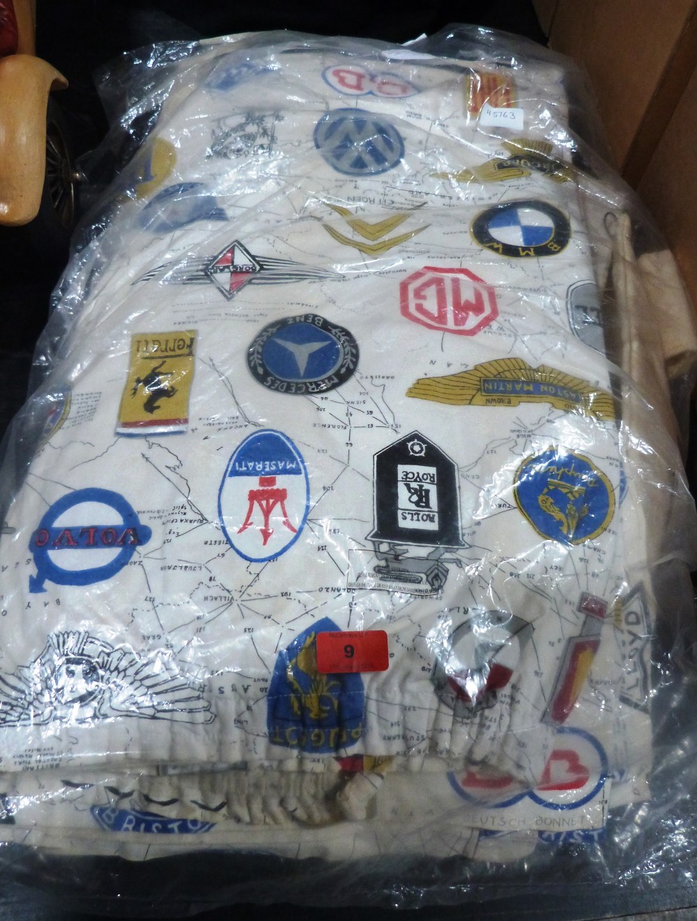 A quantity of curtains, one pair printed with motorcar marque logos
