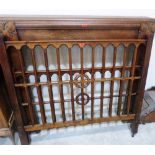 A 1930s oak chimneypiece 50' wide, a 4 oak bedstead and a coal box