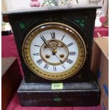 A French black slate and malachite inlaid mantle clock, the brass drum movement with Brocot