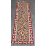 A wool Choli Kilim runner. 2.1m x 0.64m