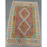 A wool Choli Kilim rug 1.2m x 0.8m